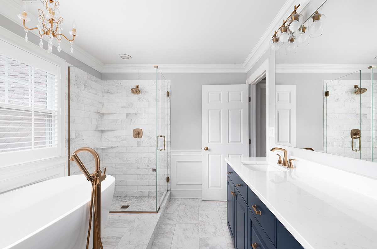 bathroom with a blue vanity cabinet